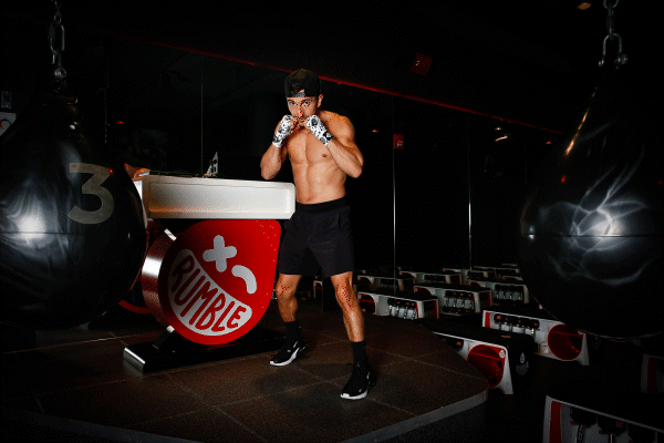 Coach wrapping hands before class begins